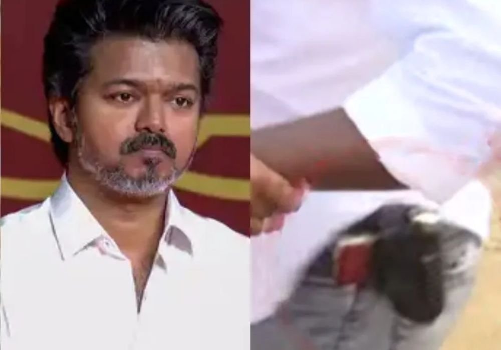 A man with a gun meeting attended by Vijay